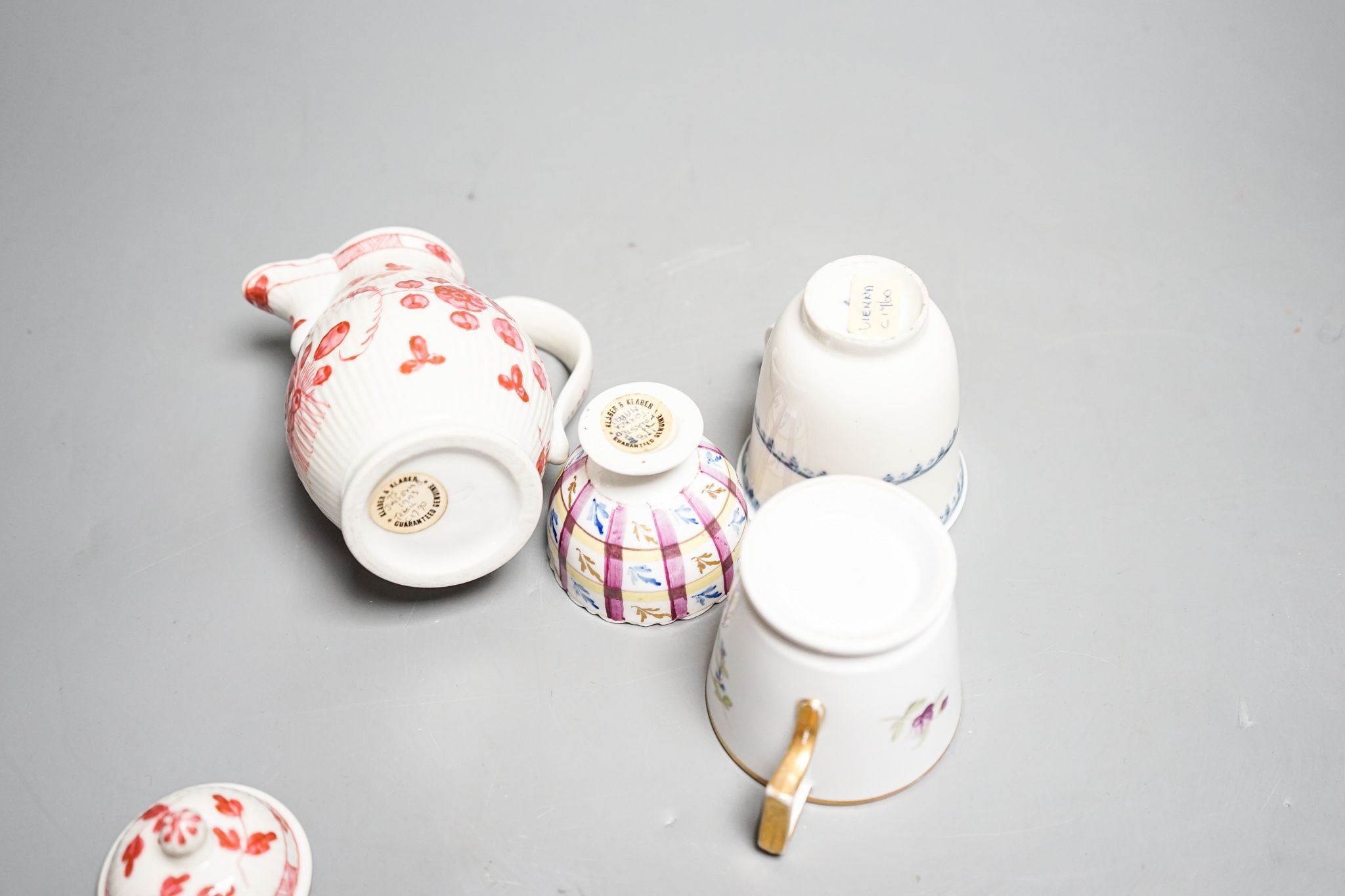 A Vienna chocolate cup, c.1760, a Tettau reeded covered jug c.1790, 13.5cm, a Volkstedt zarf cup for the Ottoman market c.1780 and a German porcelain coffee cup 14cm